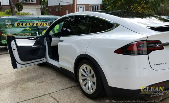 White Tesla Model X after full detailing service.