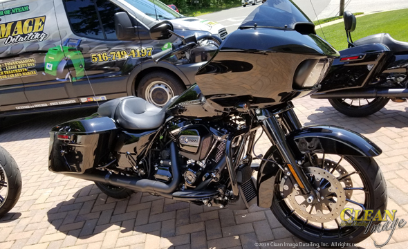 Black Harley Davidson shining after complete detailing.