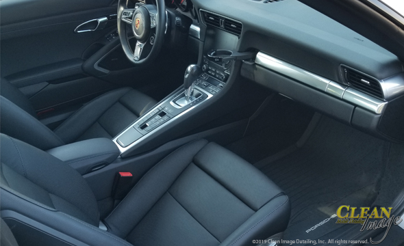 Black Porsche 911 interior freshly cleaned.