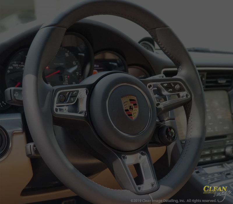 Porsche steering wheel after Executive Detailing.