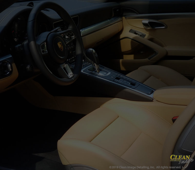 Black and tan Porsche 911 Interior after steam cleaning.