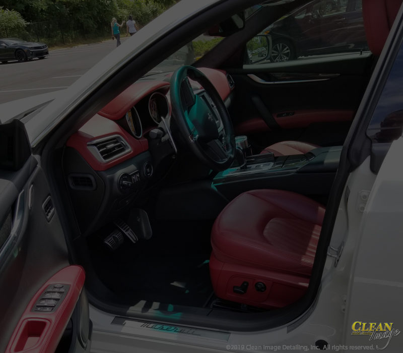 Steam clean Maserati red and black leather interior.