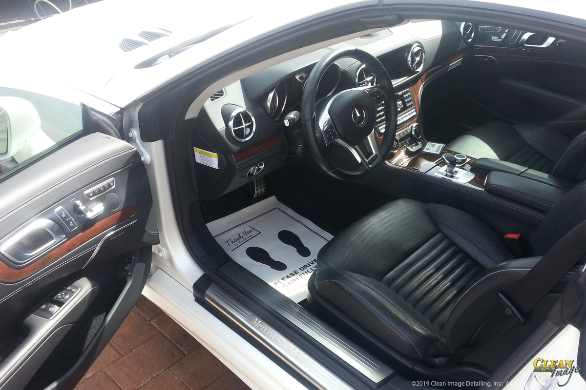 White Mercedes SL550 with black interior after steam cleaning.