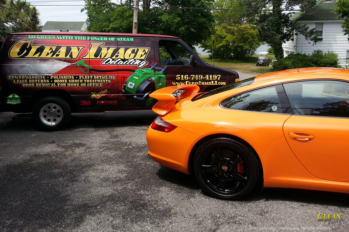 Orange Porsche 911 with Clean Image van.